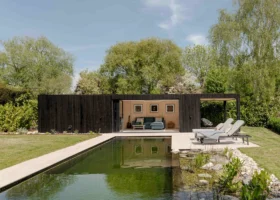 Prefabricated pool house outbuilding with bifold doors