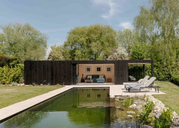 Prefabricated pool house outbuilding with bifold doors