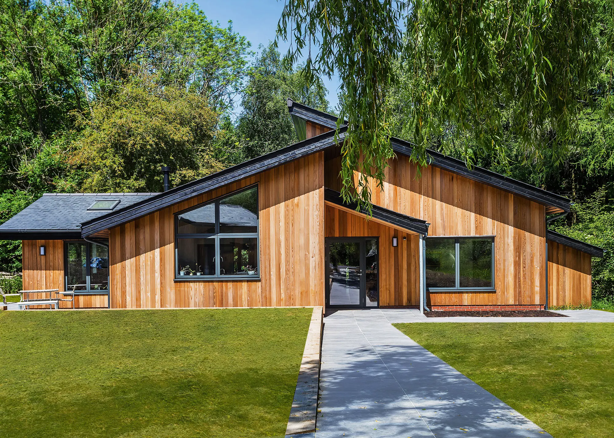 Countryside home with a contextual cedar-clad exterior