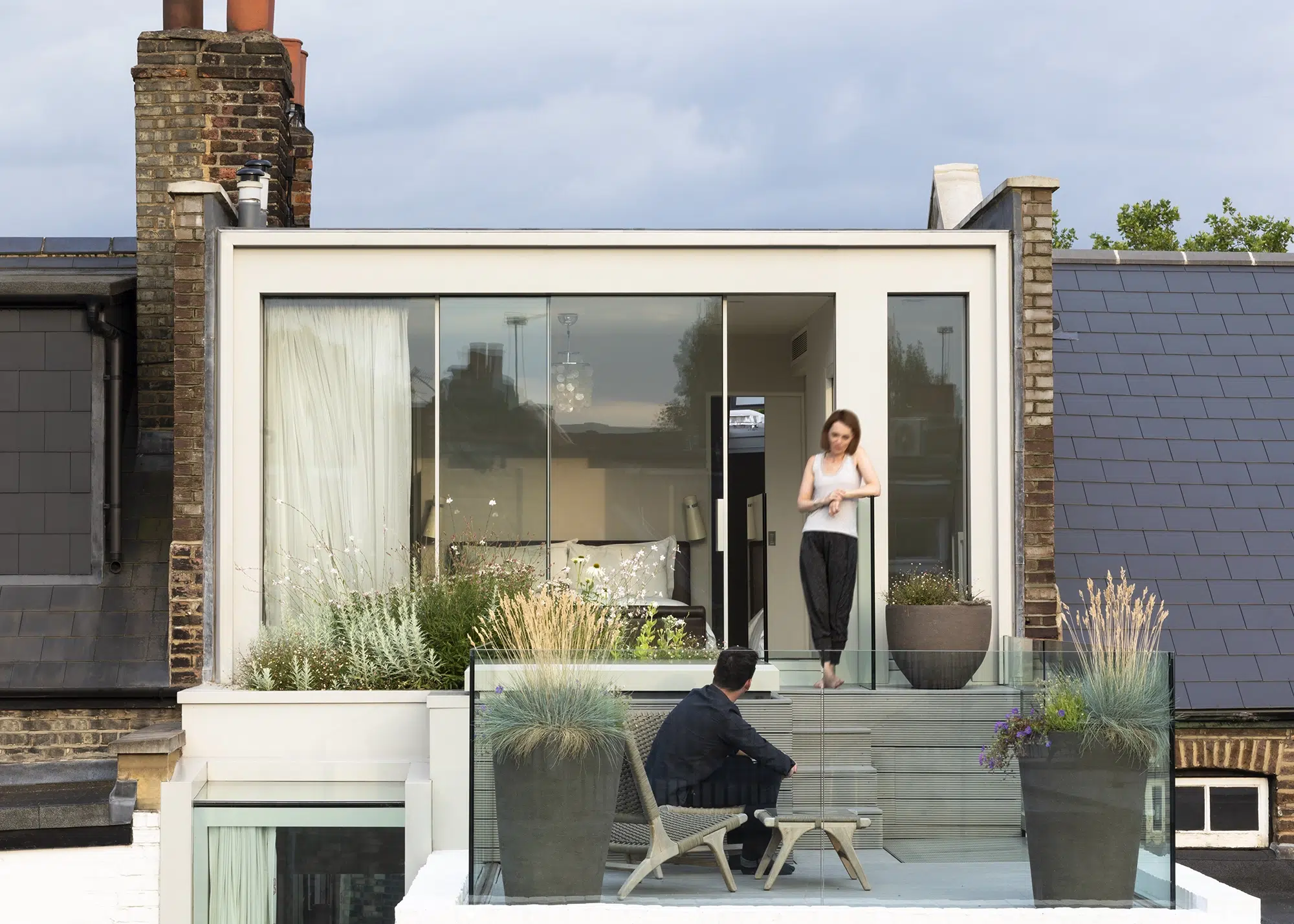 Terraced house with a loft extension and balcony space