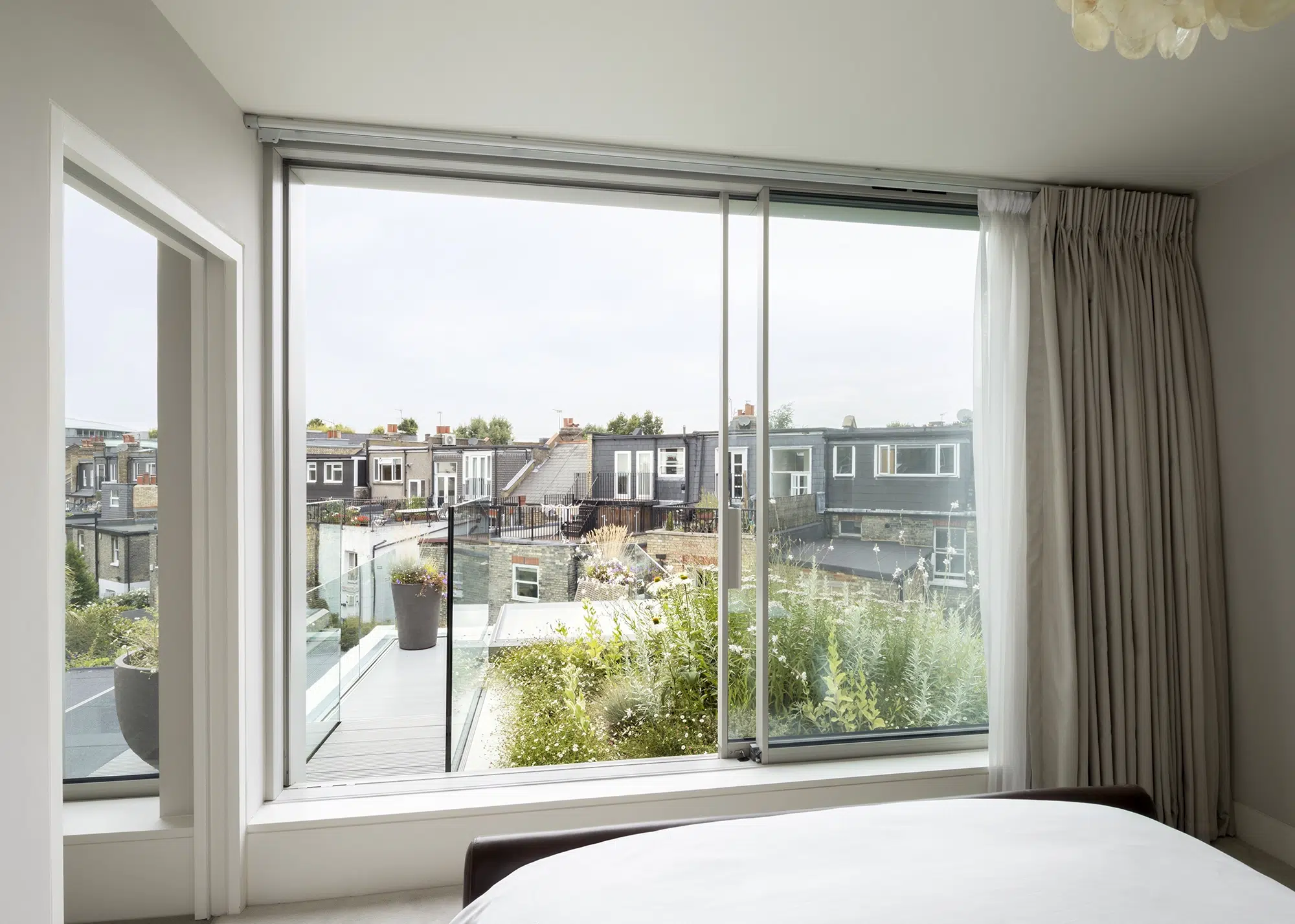 Terraced house with a loft extension and balcony space