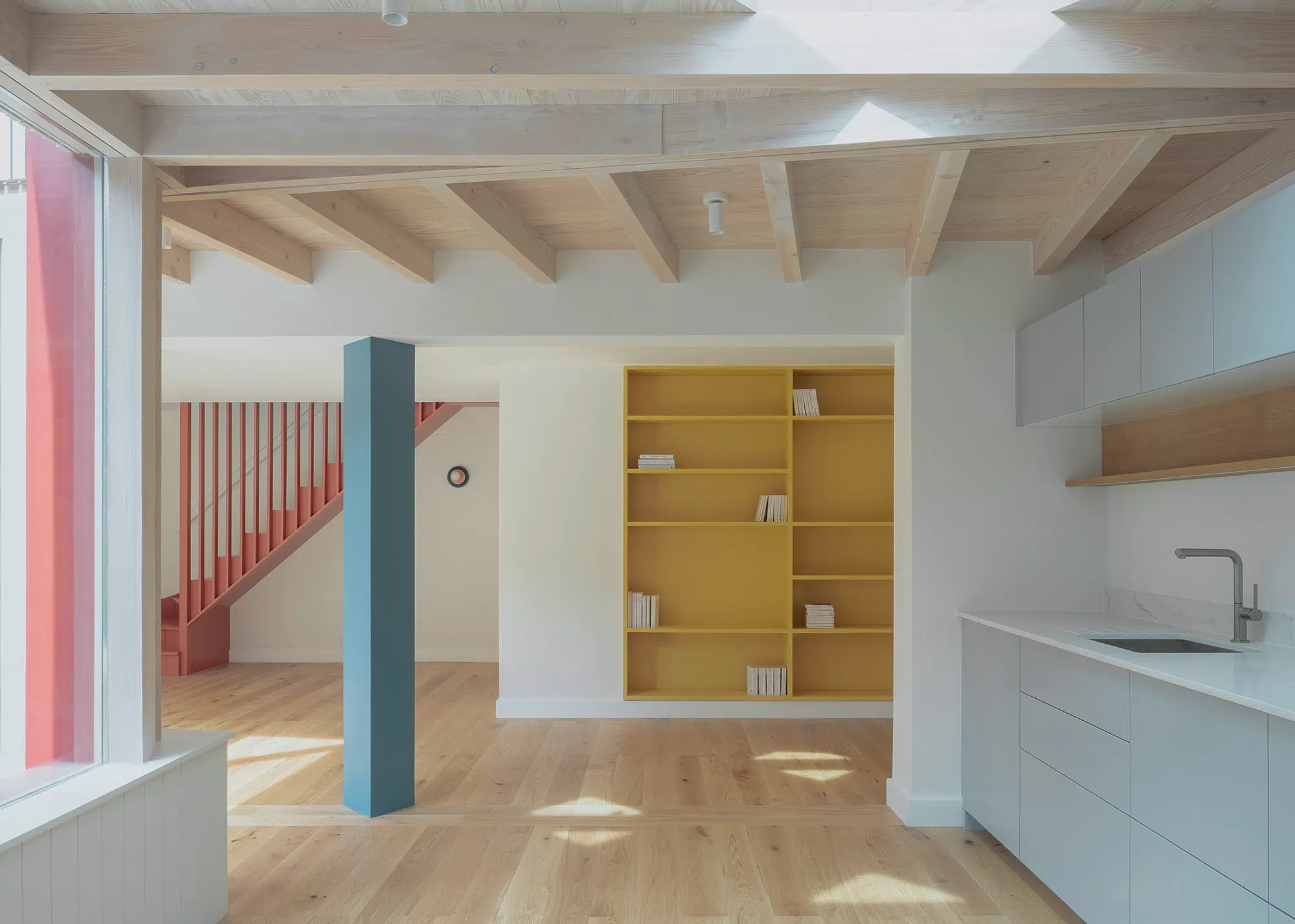 Open-plan timber frame extension with a colourful interior scheme