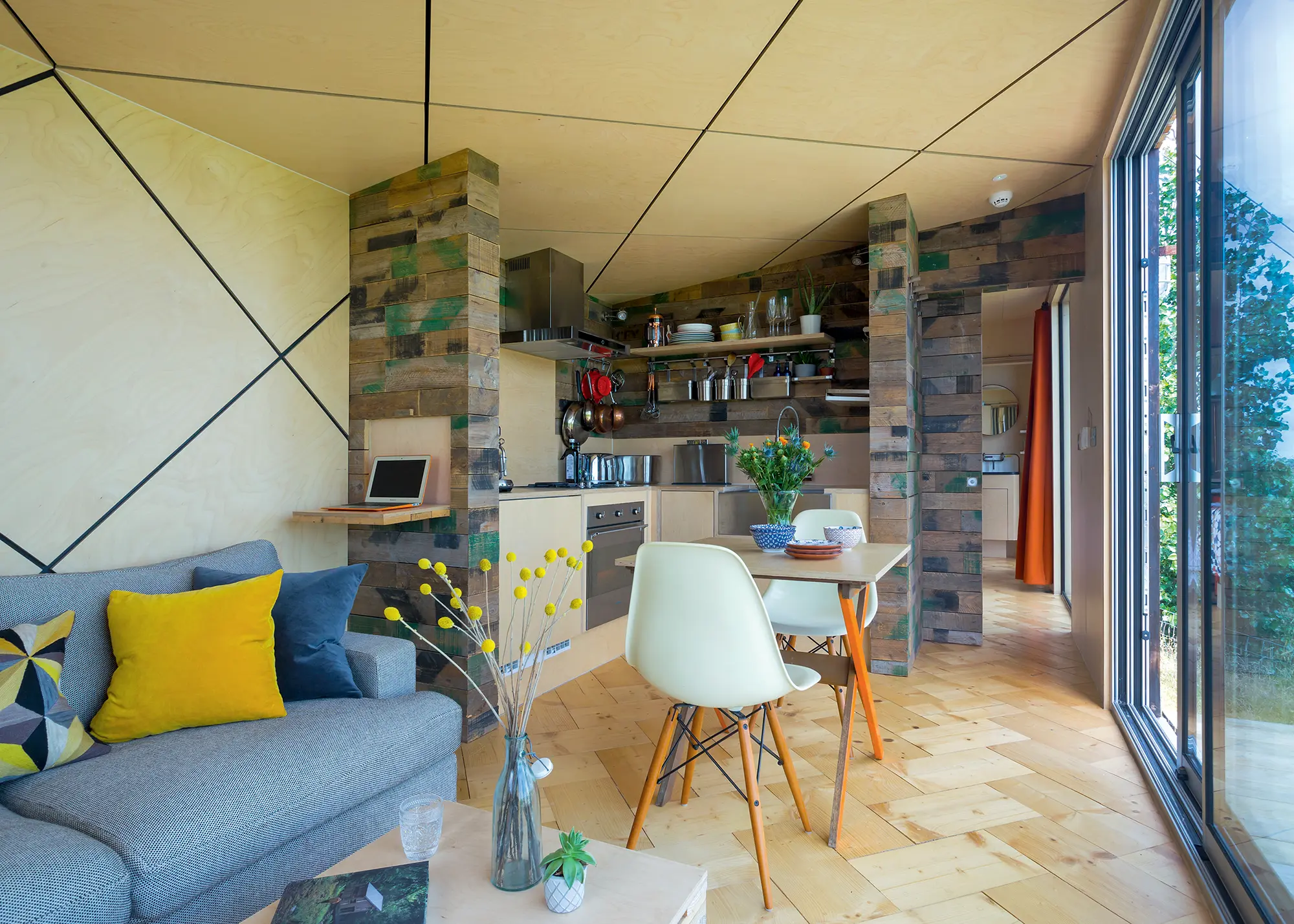 Mobile timber frame tiny home with glazed sliding doors