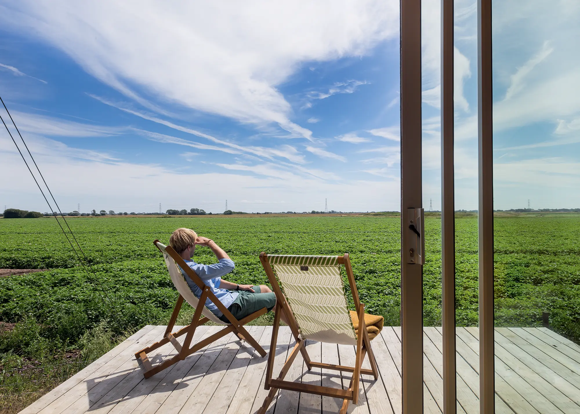 Mobile timber frame tiny home with glazed sliding doors