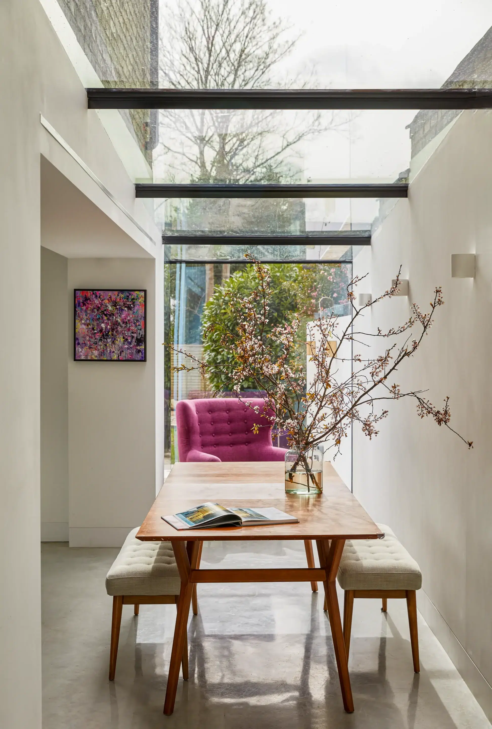 Small 16m² glass box extension for a family home
