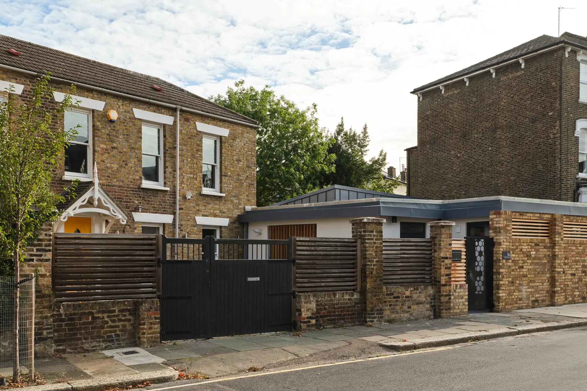 Low-lying infill extension doubles house size